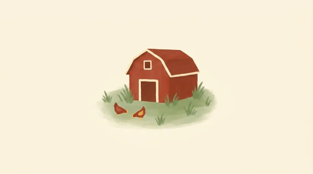 A small red barn in a green field